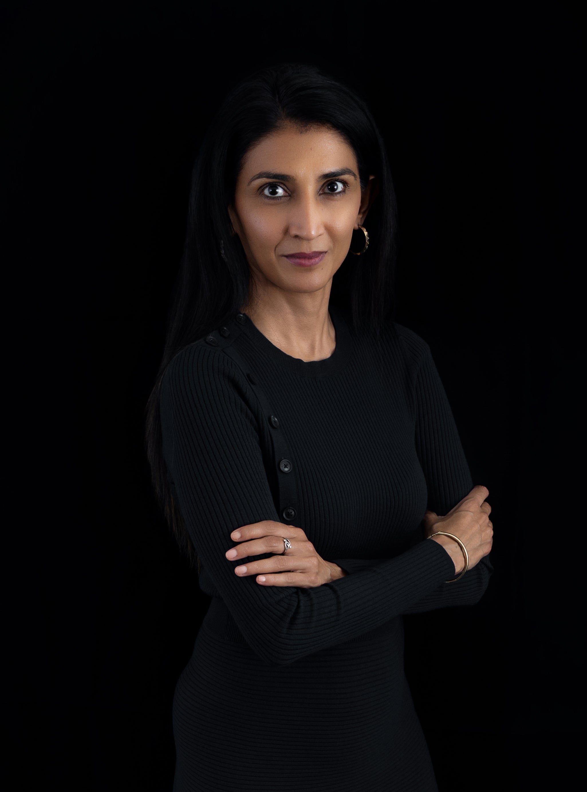 Midlength- Root & Ritual- About- Founder Story- Arwa with folded hands-Black Dress