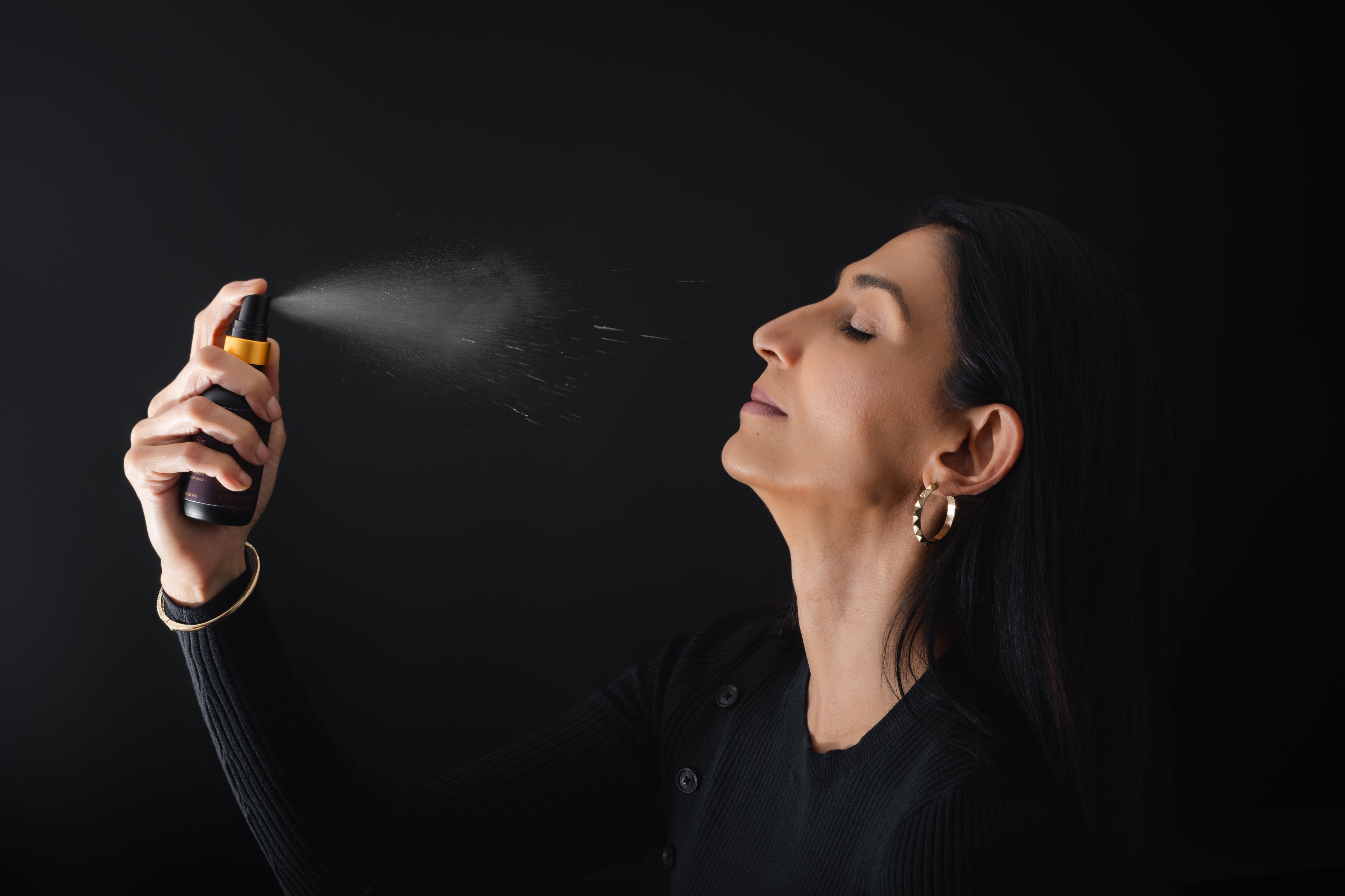 Root & Ritual-Homepage_Gallery_Founder spraying Mist