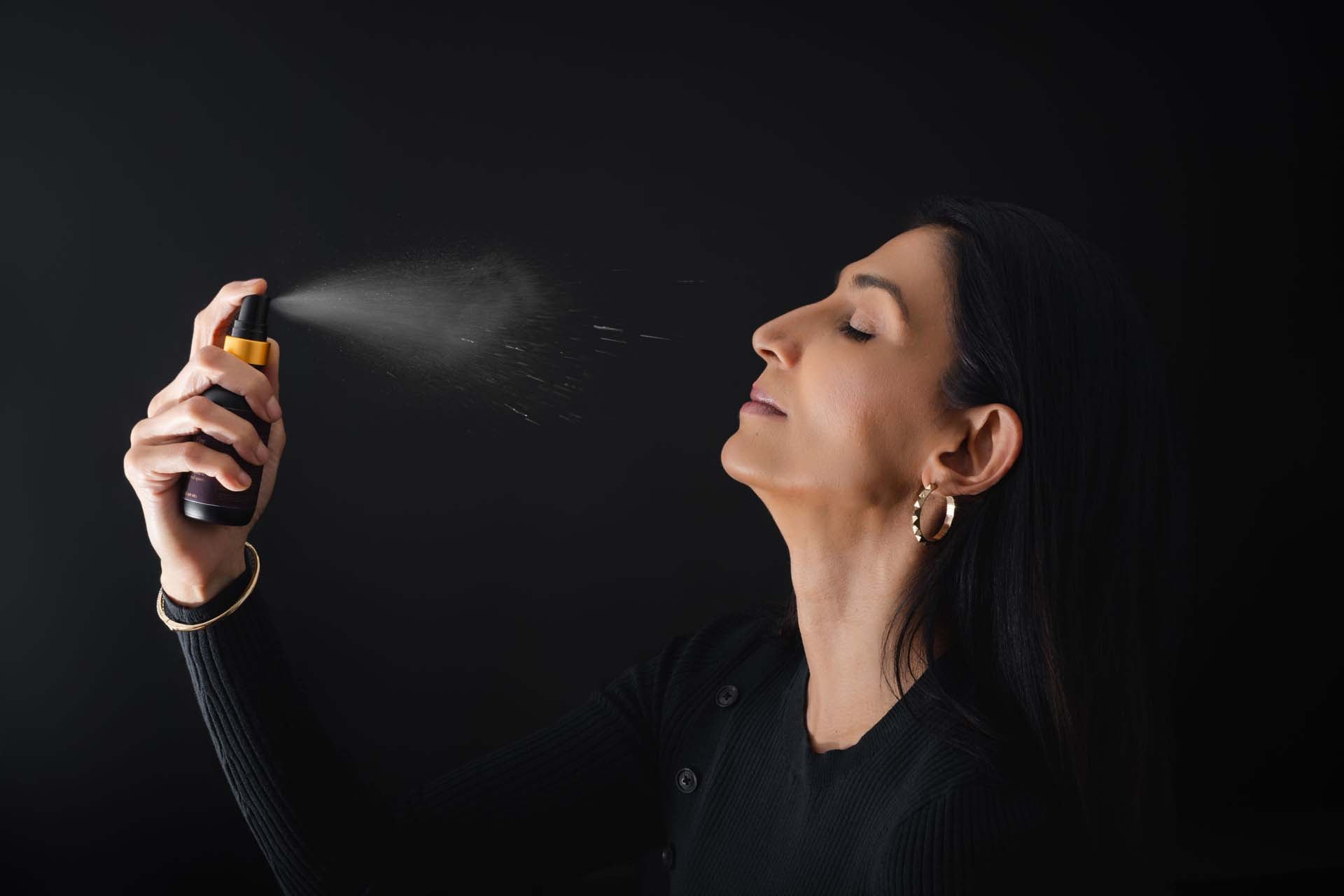 Root & Ritual – Founder Arwa using Heart Fire Mist ritual